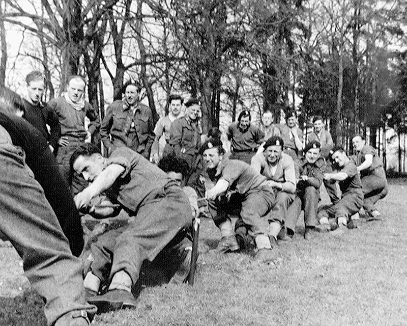 Soldiers of the 15th/19th King’s Royal Hussars taking part in a sports-day ‘tug of war’, 12 April 1945
